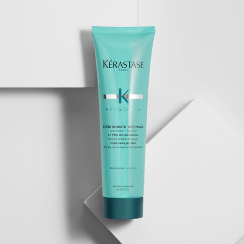 Kerastase Resistance Extentioniste Thermique hair cream in a turquoise tube, positioned on a white background.