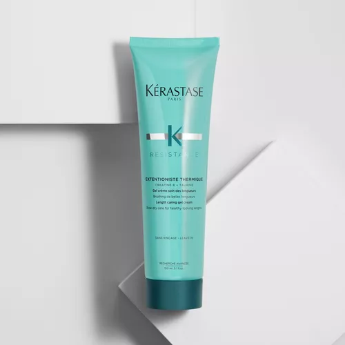 Kerastase Resistance Extentioniste Thermique hair cream in a turquoise tube, positioned on a white background.