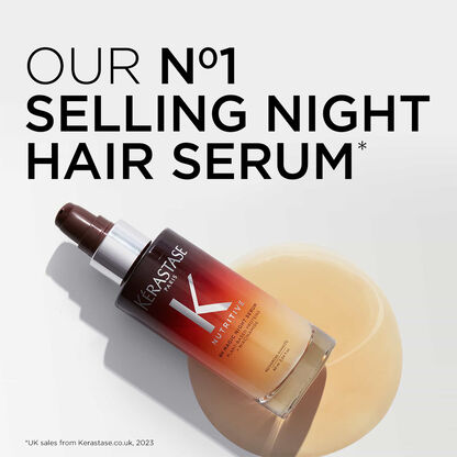 Kerastase N°1 selling night hair serum in a sleek bottle, displayed against a soft background.