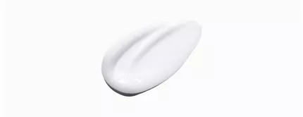 A smooth, white cream or lotion blob on a light background, showcasing its silky texture.