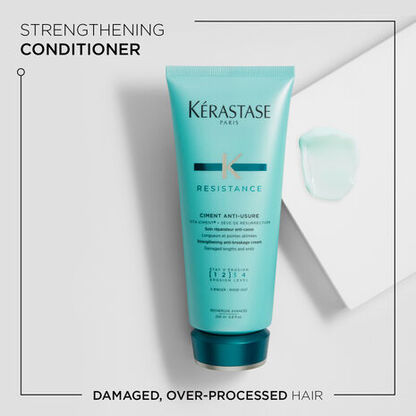 Kerastase Resistance Strengthening Conditioner tube with a teal design, promoting repair for damaged, over-processed hair.