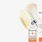 An arrangement of Kerastase hair care products including shampoos, conditioners, a serum, and a mask, all in sleek bottles and jars with a modern design. The products feature a white and orange color scheme.