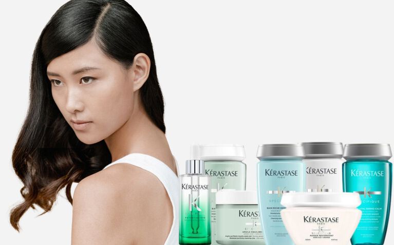 Kerastase Specifique model with hair care products for unbalanced scalps.