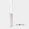 A clear test tube containing a white substance, labelled \'Niacinamide\' on a light grey background.