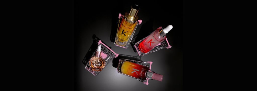 Image with a black background with four best sellers from Kerastase each in a little cart. 