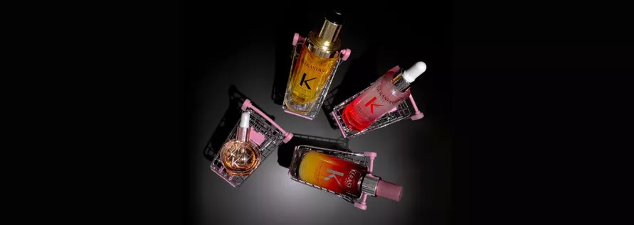black image with top bestellera from kerastase, each on a mini shopping cart.
