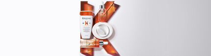 Alt text: A flat lay arrangement of four hair care products from the Kerastase Nutritive line, displayed against a light background, with an artistic orange "K" shape formed by the products.