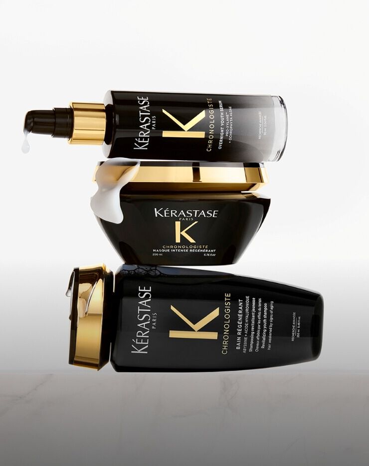 Three black bottles stacked on top of each other on a white background​