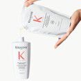 Refilling a 500ml bottle
of Kerastase Premiere
shampoo with 500ml
pouch