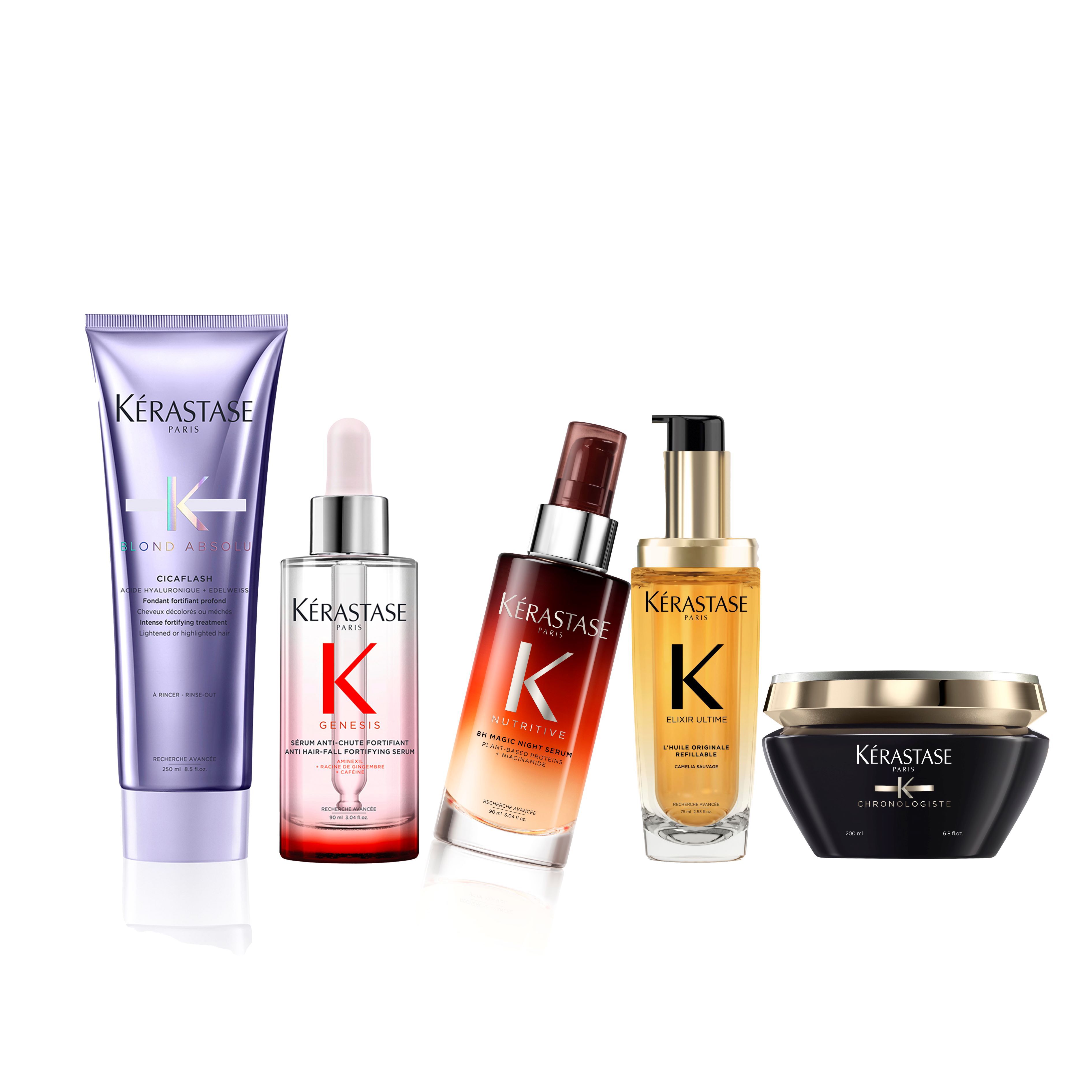 A collection of Kerastase hair care products, including a shampoo, serums, and a treatment mask, arranged neatly.