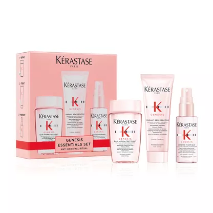 A Kerastase Genesis Essentials Set featuring hair care products for anti-hair fall, presented in a stylish pink box.