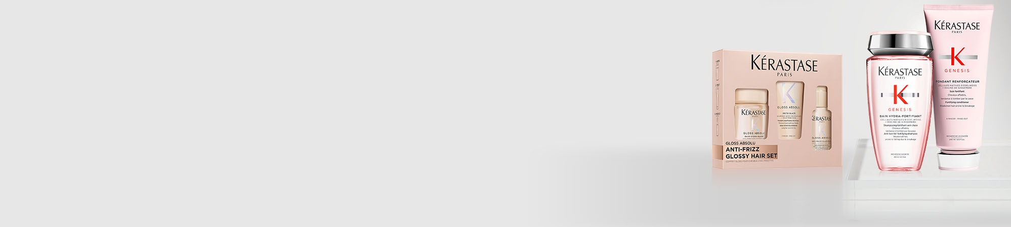 Two Kérastase bundles side by side on a grey background accompanied by text