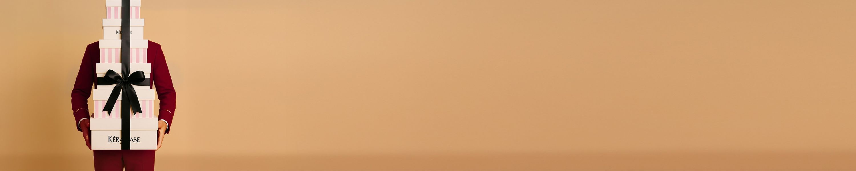 A Kérastase gift box featuring haircare products, promoting the concept of gifting for self-care or loved ones.
