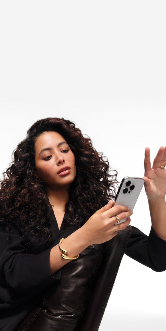 A woman with flowing brown hair, against a muted purple background. Text at the top reads FIND YOUR
HAIRCARE ROUTINE and it takes us to the hair diagnostic tool
